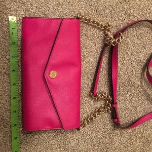 Hot pink Michael kors wallet on a chain